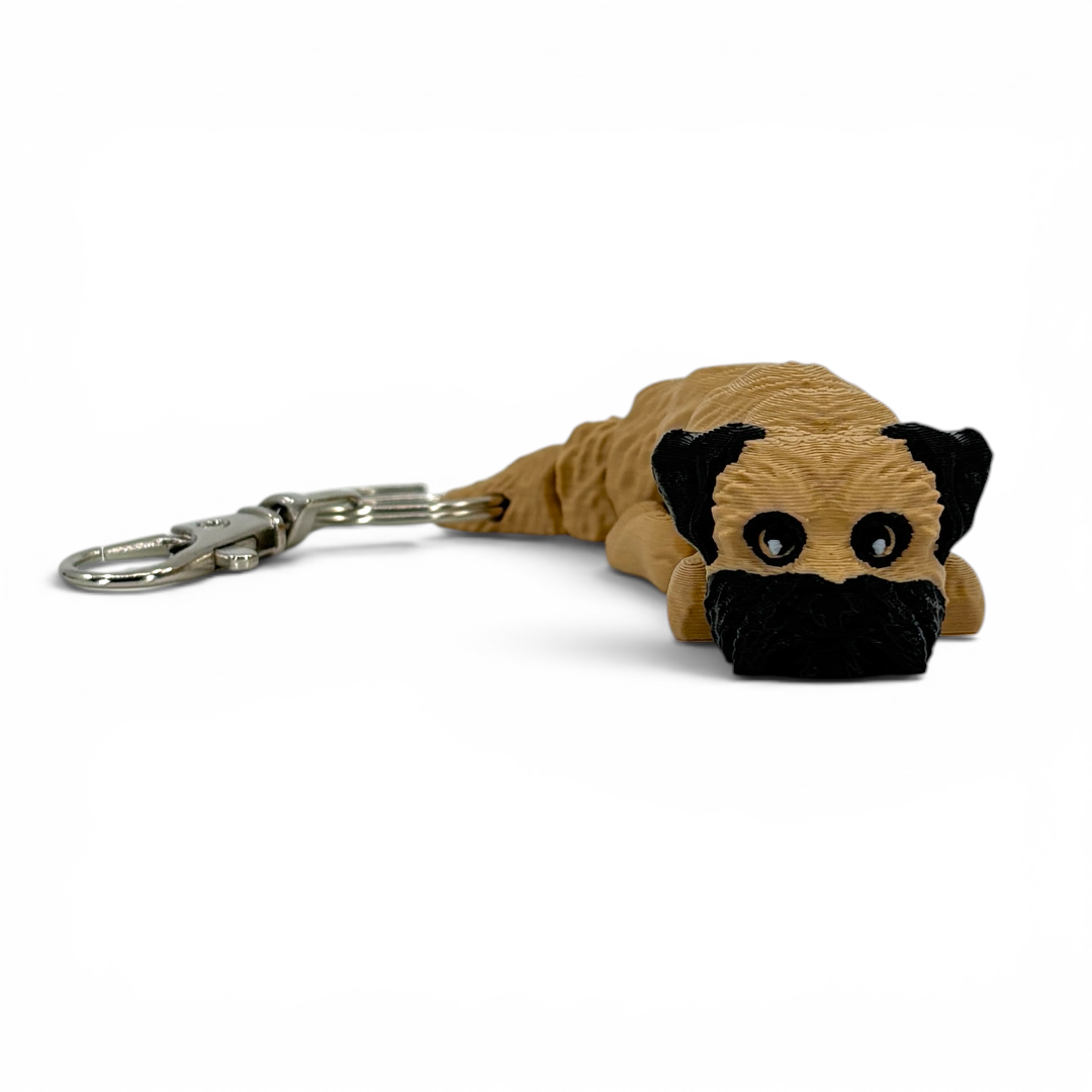Dog-shaped keychain on a white background