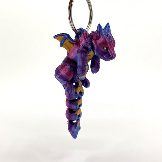view of midnight dragon keychain hanging in air
