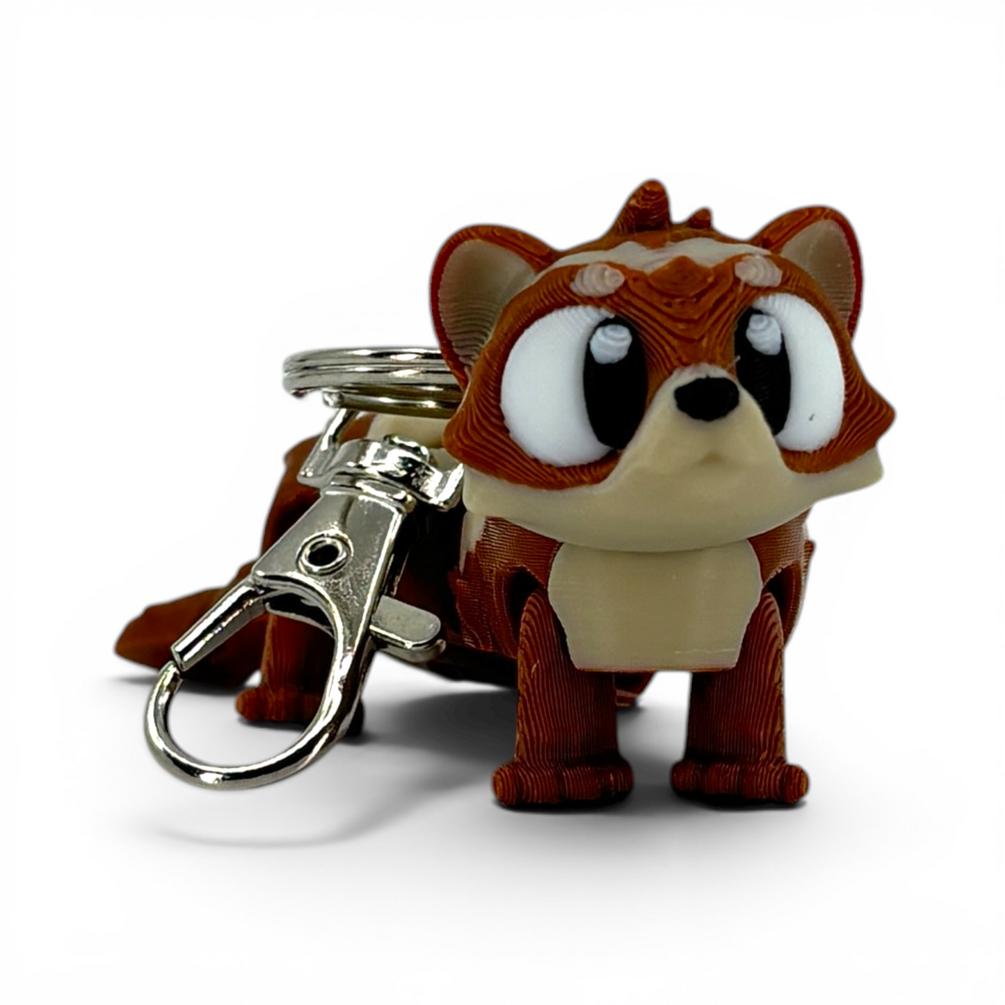 ferret with large eyes keychain on a white background
