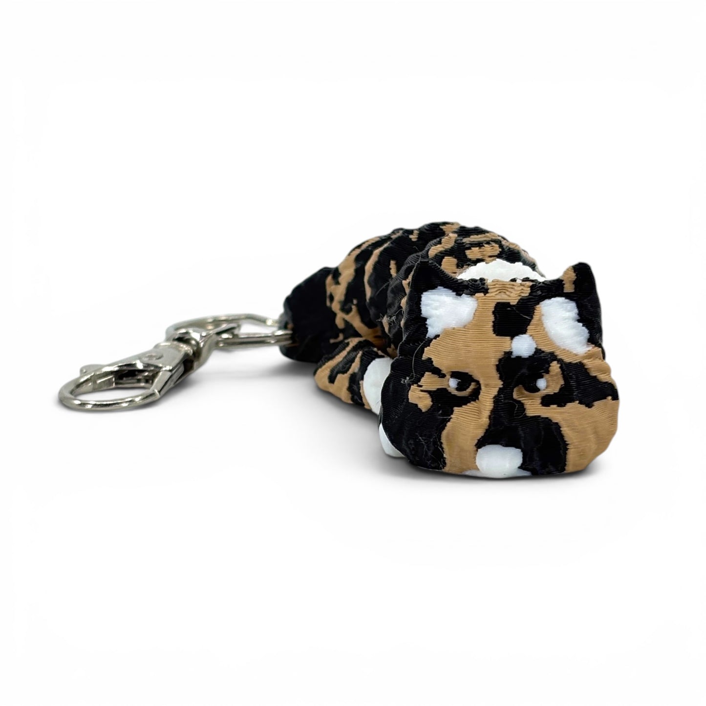 brown black and white pattern cat keychain on a white background