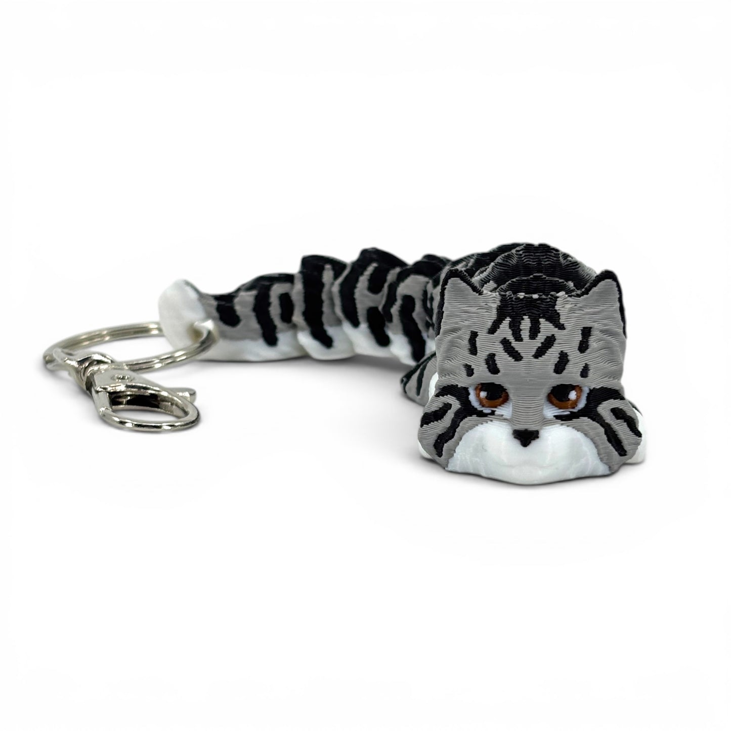 Cat-shaped keychain on a white background
