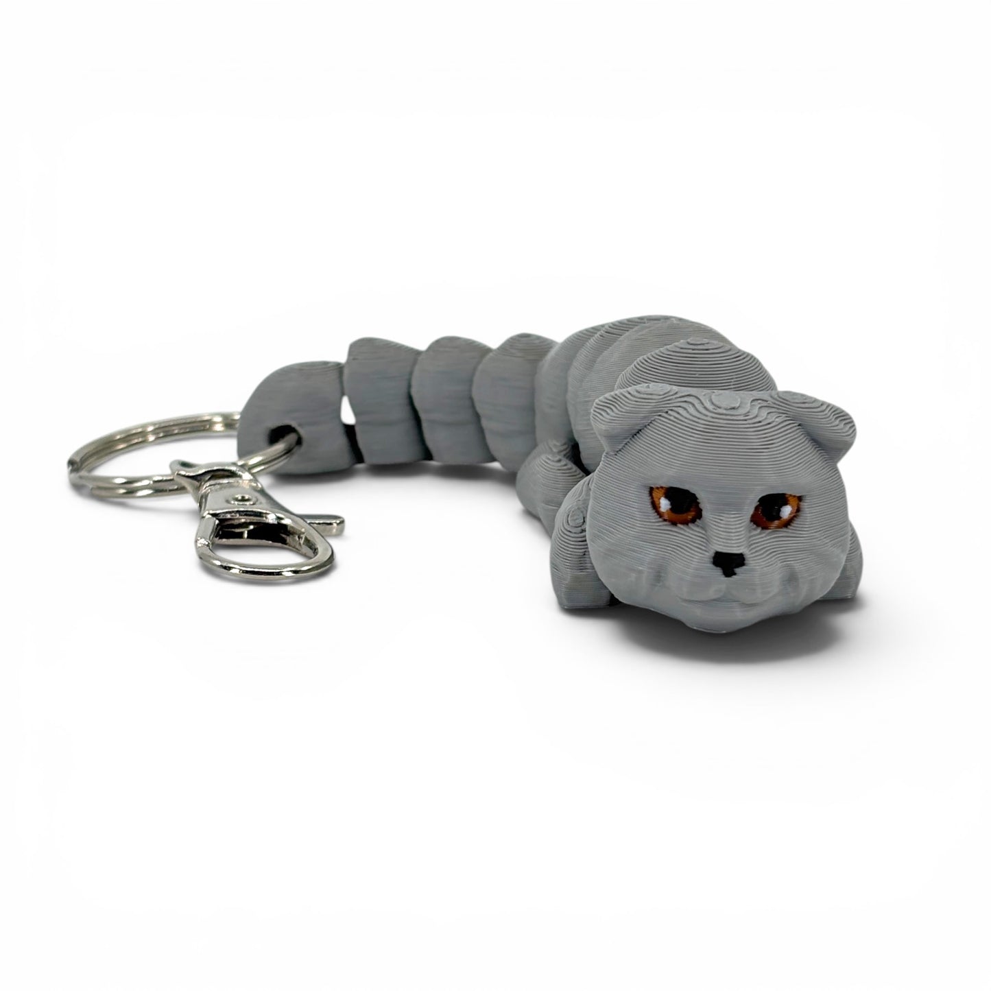 Gray cat with folded ears keychain on a white background