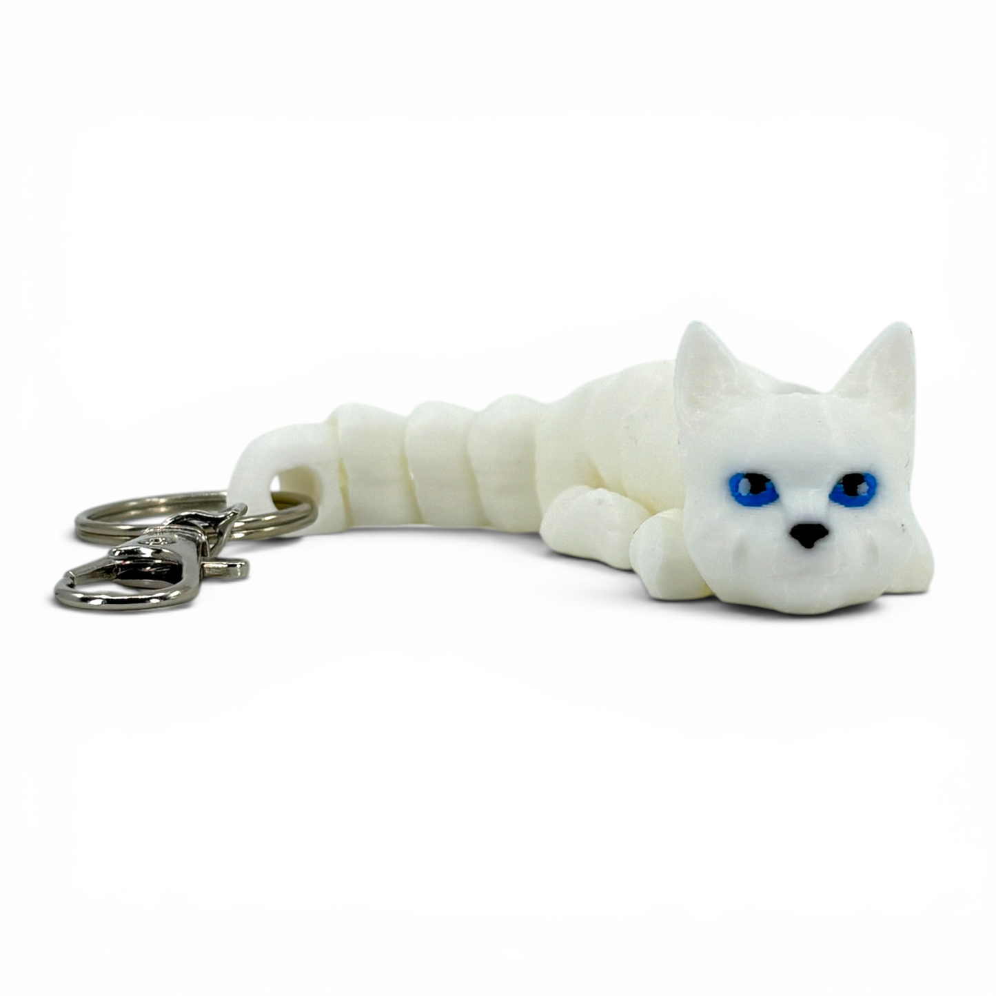 White cat keychain with blue eyes on a white background