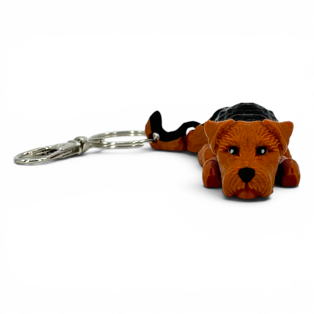 Dog-shaped keychain on a white background