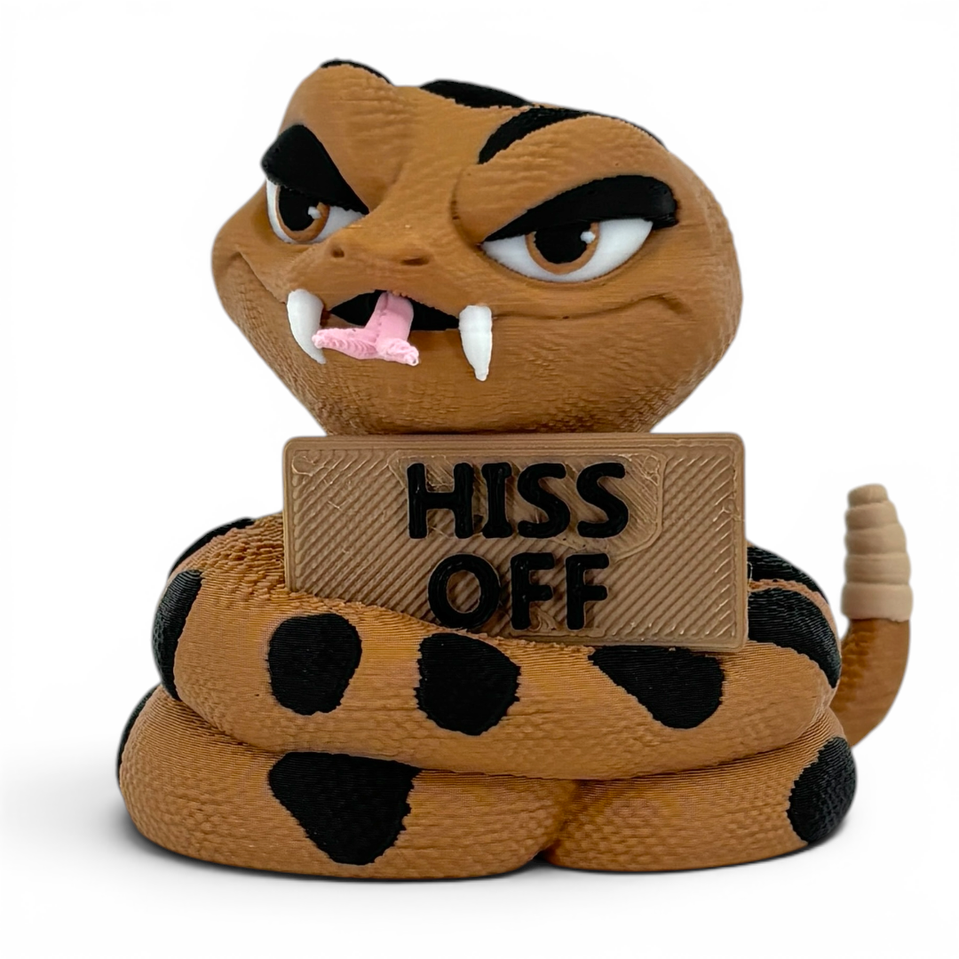 3D printed rattlesnake with a sign saying 'Hiss Off' on a white background