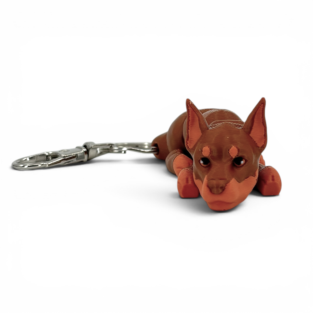 Dog-shaped keychain on a white background